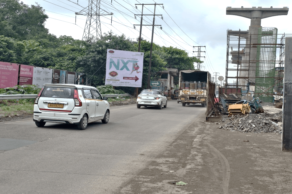 MediaWisse outdoor hoarding at Vicco Naka Near Regency Anantam Entrance Dombivli East: MediaWisse-operated board at Vicco Naka Near Regency Anantam Entrance Dombivli East along the Kalyan-Shil Road corridor (photo 2)
